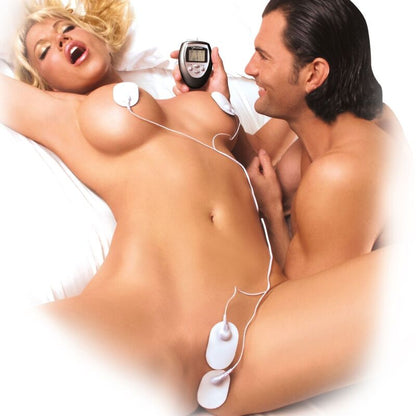 Close-up of the FETISH FANTASY SERIES Kit Eletroestimulação Digital, showing the control unit and electrode pads.