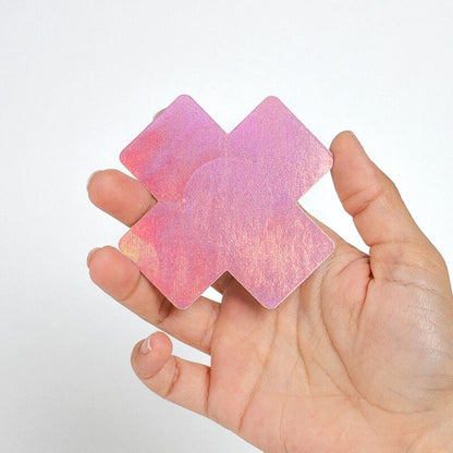 Close-up of SECRET PLAY Protetores de Mamilo Cruz Holográfica, 2 Pares, showing the black and pink designs.