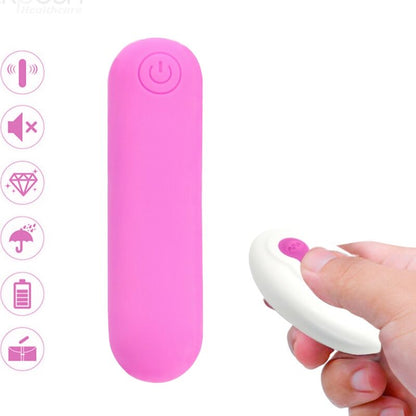 Close-up of the ARMONY Splash Joline bullet vibrator in pink silicone with its remote control, highlighting its compact design.